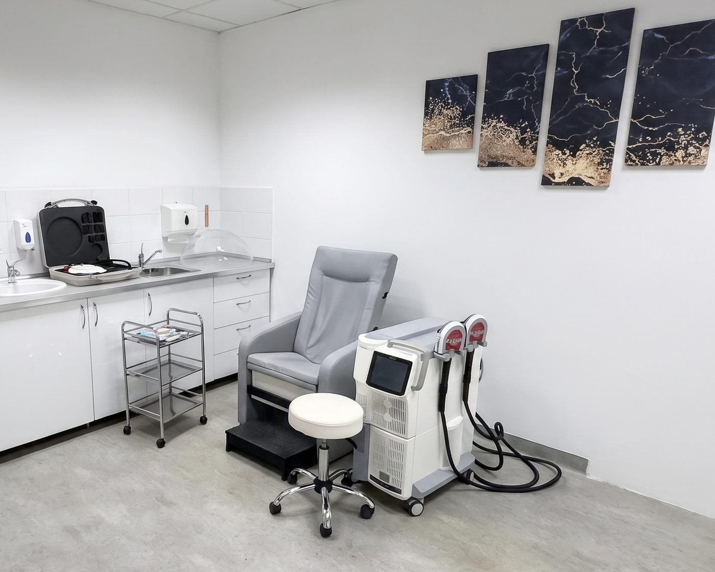 A treatment room with a reclining chair and a mobile therapy device